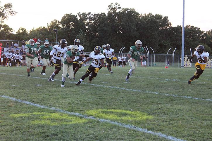 Andre Richie (12) rushing the ball against Hazelwood Central. 