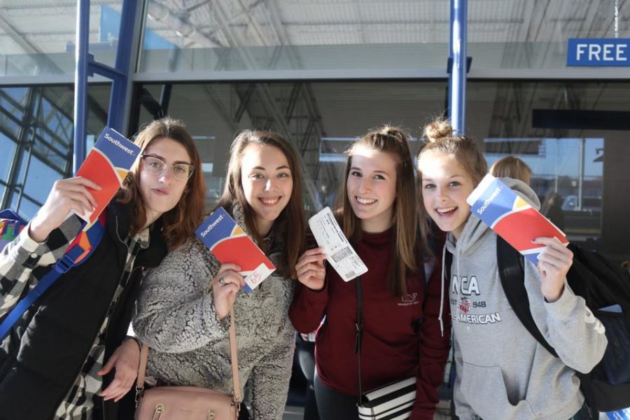 Dayle Zimmerman (10), Jessica Belle Kramer (12), Katie Meyer (11) and Savannah Gibson (10) waiting at the airport.