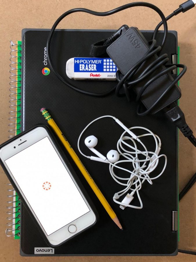 Supplies for the 2020-2021 school year rely more heavily on technology than ever before. This is a photo of one LHS student´s essentials for online learning: pencil, earbuds, charger, cell phone, eraser, notebook and school-issued Chromebook. 