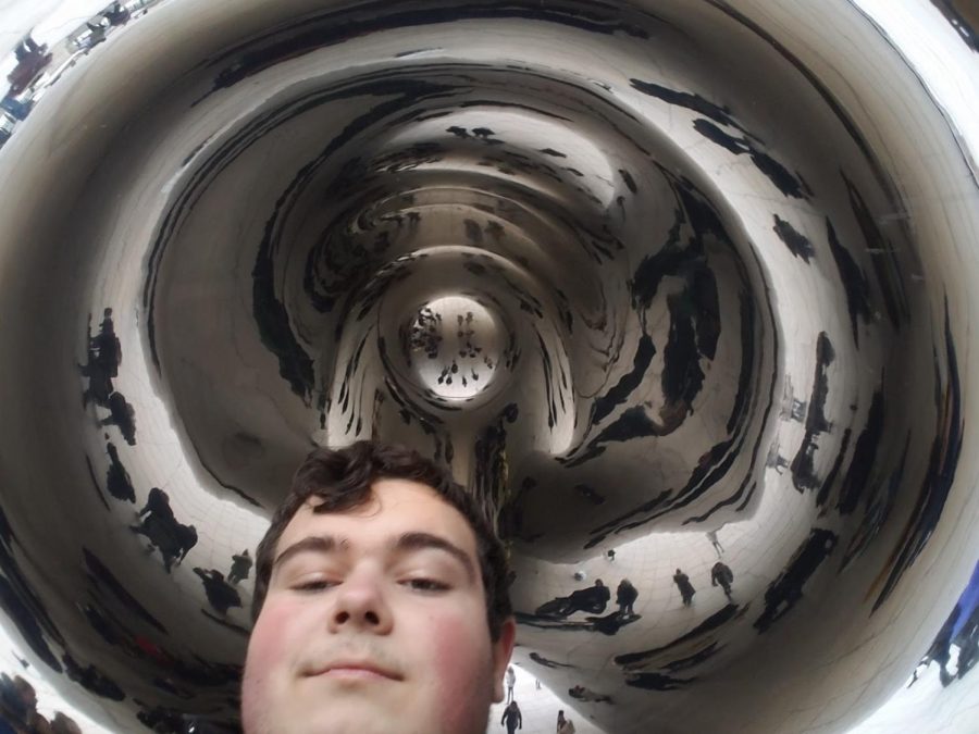 Slane poses underneath the famous Chicago Bean on the jazz trip with the school band.