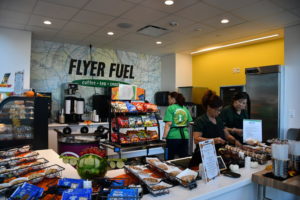 Food service staff working on supplying lunch to students - Photo Credit by Lindsey Pham 