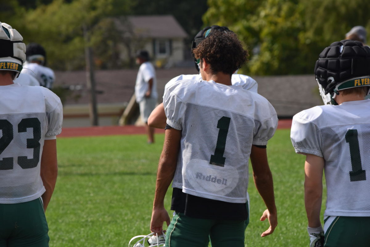 Wide Receiver Terrell Watts on the sideline waiting for the offensive line to
participate in the drill.