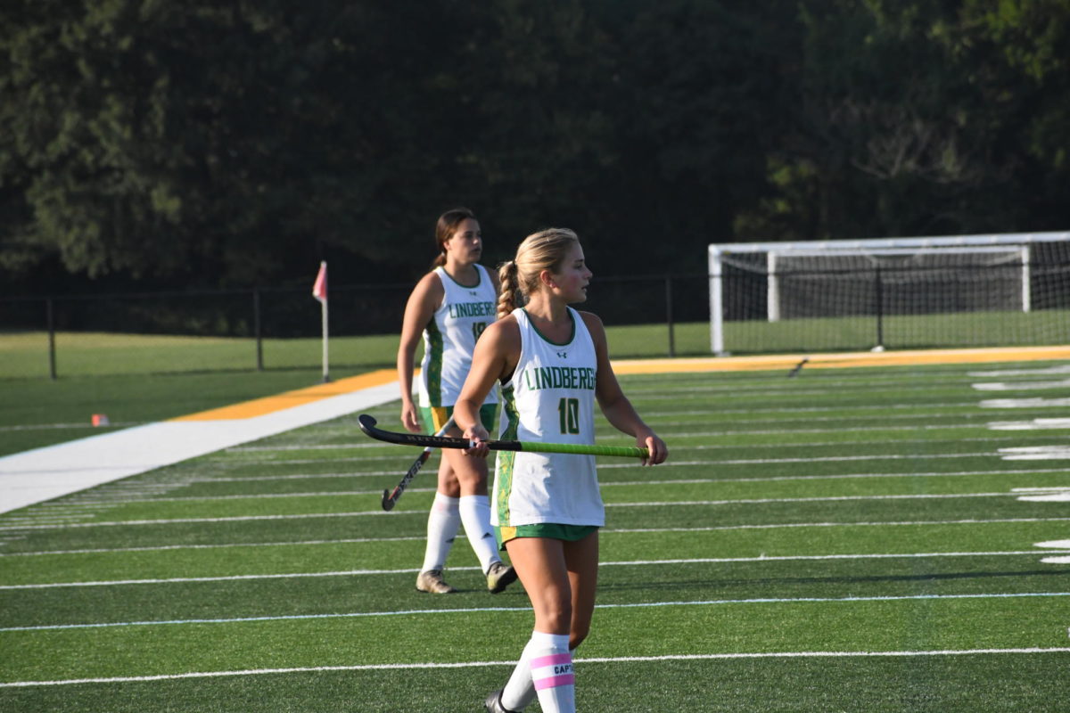 Zoe+Earley+and+Isabella+Adams+take+the+field+at+their+varsity+field+hockey+match.