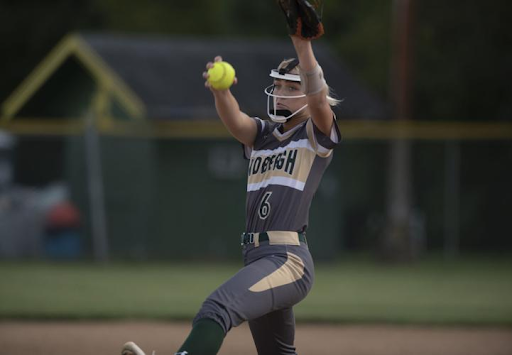 Gabby McBride throws a windmill pitch.