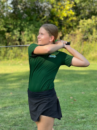 Junior Reese Reinhardt (11) looks after her shot. 