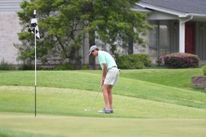 Madrid lines up a long putt.