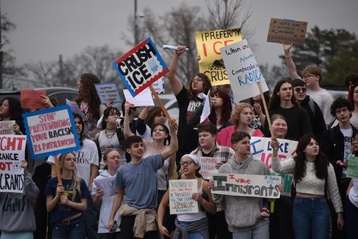Students protest on the sidewalk by Lindbergh Blvd.