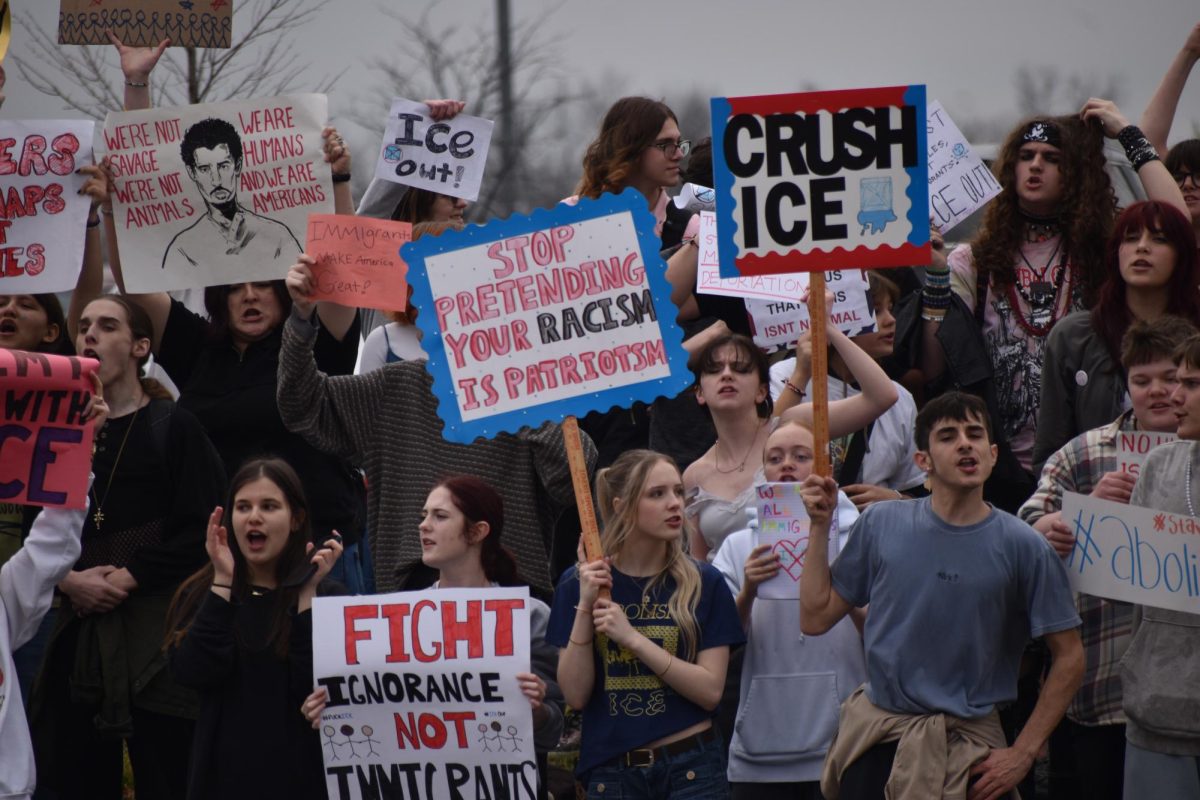 Students protest on the sidewalk by Lindbergh Blvd.