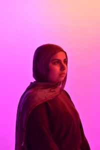 Ayah Aldoum, the Youth for Justice founder and a Lindbergh freshman, poses for the camera in Lindbergh's broadcasting and photo studio. 