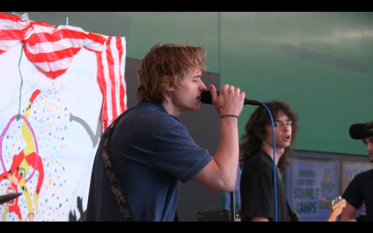 LHS students part of a band called "Blame the Internet." Singing to contribute to cancer research. 